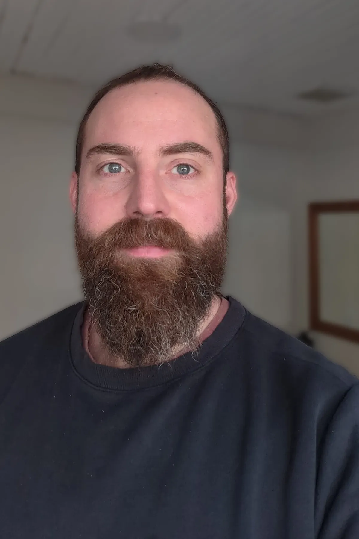 Portrait of Nicholas Daly, close-cropped, looking at the camera.